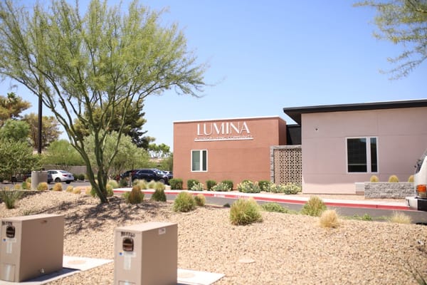Exterior view of Lumina facility with landscaping