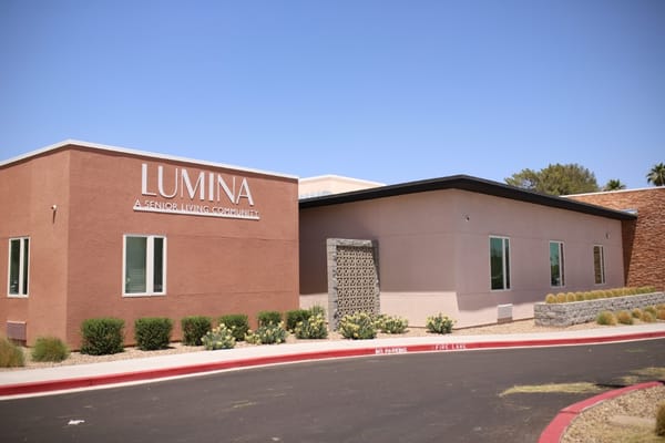 Exterior view of Lumina senior living community building