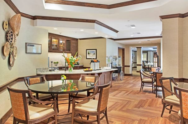 Interior common area with a dining table and kitchen