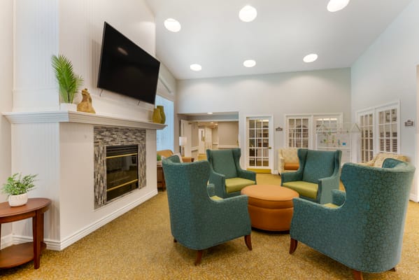 Cozy common area with comfortable seating and a fireplace