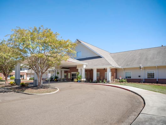 Exterior view of Brookdale Clinton entrance with landscaping