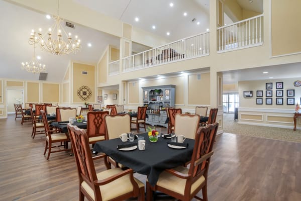 Interior view of a dining area with tables set for meals