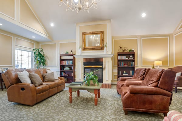 Comfortable common area with seating and bookshelves