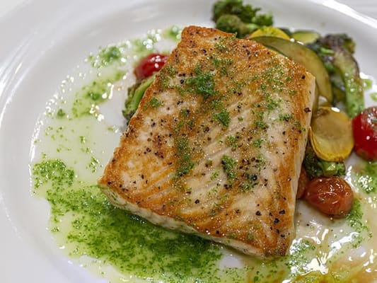 A gourmet meal of salmon with vegetables