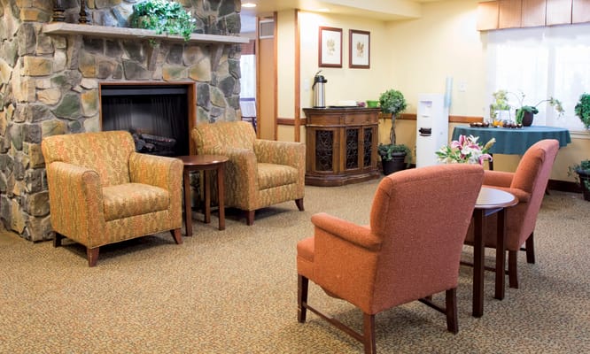 Cozy common area with seating and a fireplace