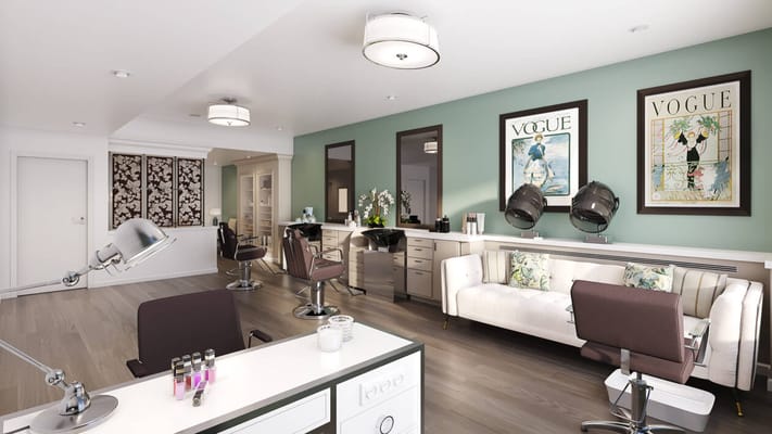 Bright salon with styling stations and seating area.