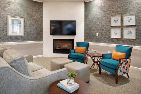 Cozy lounge area with comfortable seating and fireplace