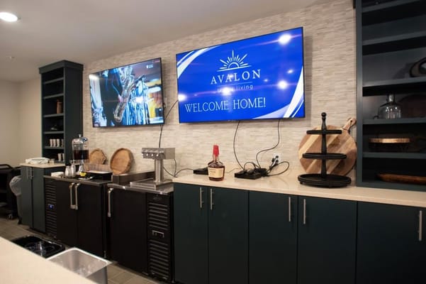 Interior view of a welcoming community area with televisions