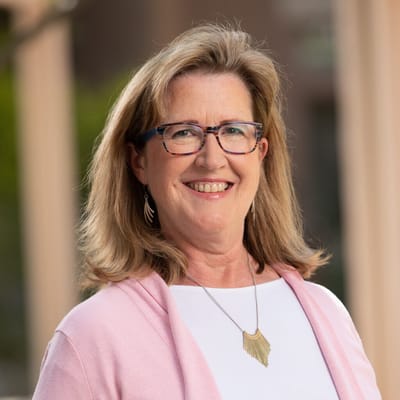 Staff member smiling outside the facility