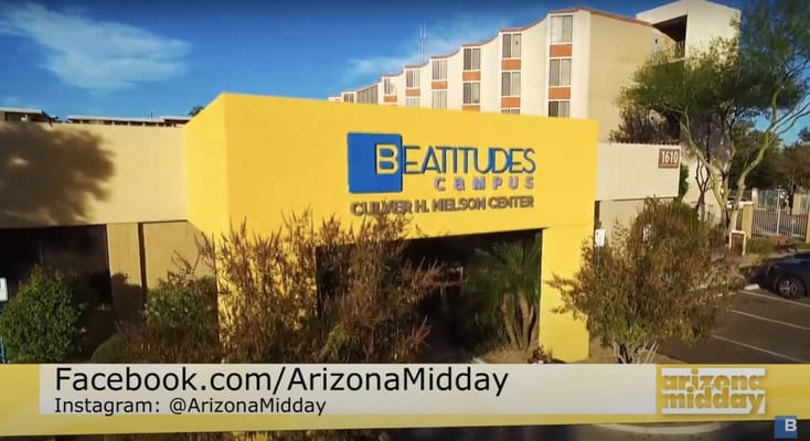 Building entrance with facility name and logo