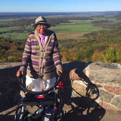 Senior woman at a scenic overlook with a walker