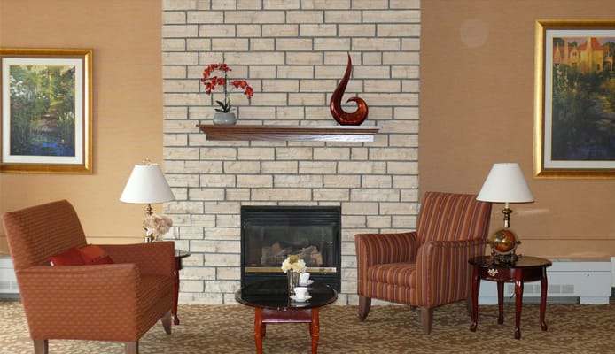 Cozy common area with a fireplace and seating