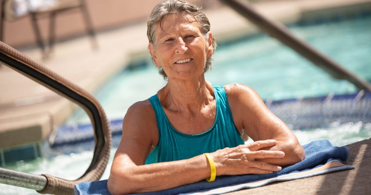 Older adult enjoying time in a spa pool