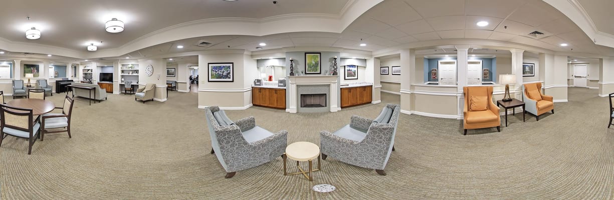 A spacious common area with seating and art