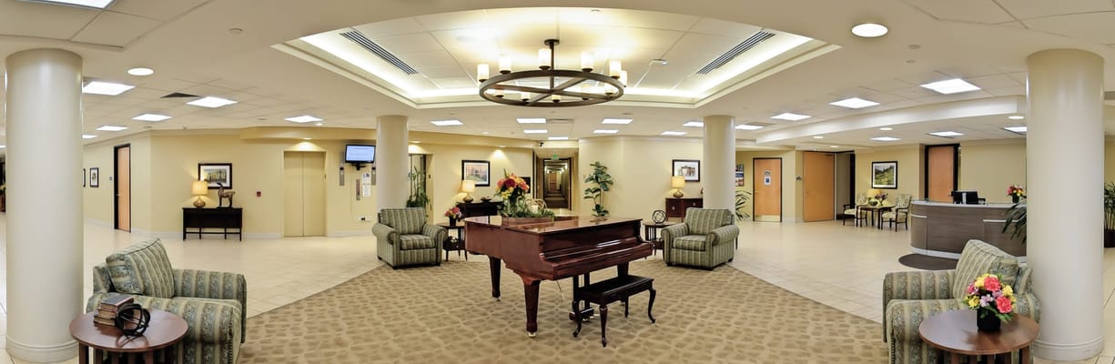 Interior view of a lobby with seating and piano