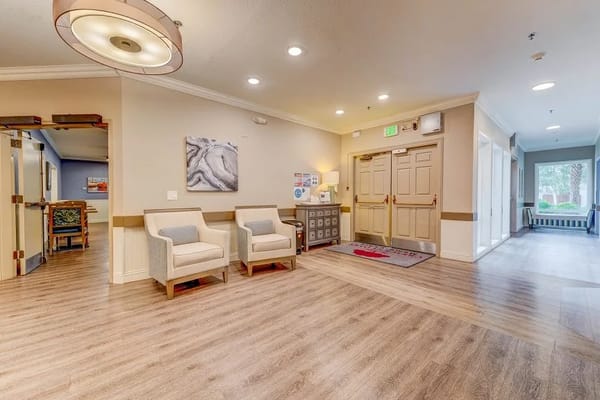 Bright common area with seating and lobby access