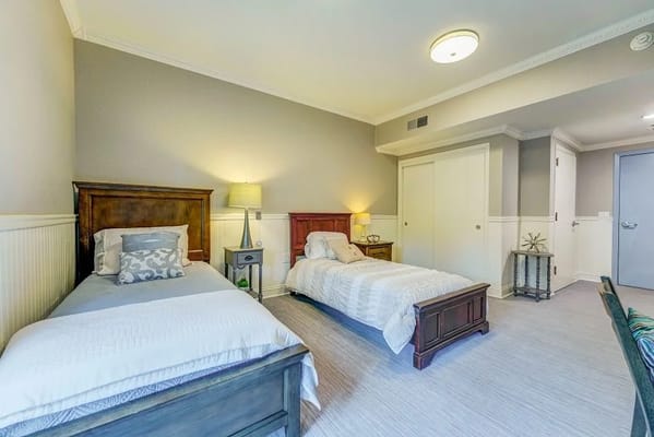 A cozy interior view of a resident room with two beds