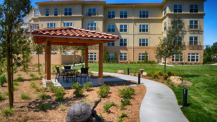 Outdoor seating area with a gazebo and landscaping
