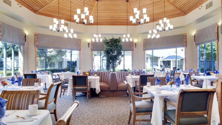 Elegant dining room setup with tables and chairs