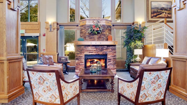 Bright and welcoming lobby with seating and fireplace