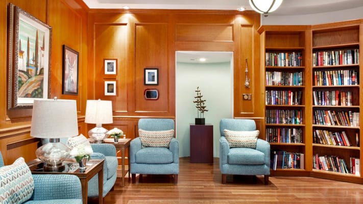Cozy interior lounge area with bookshelves and seating