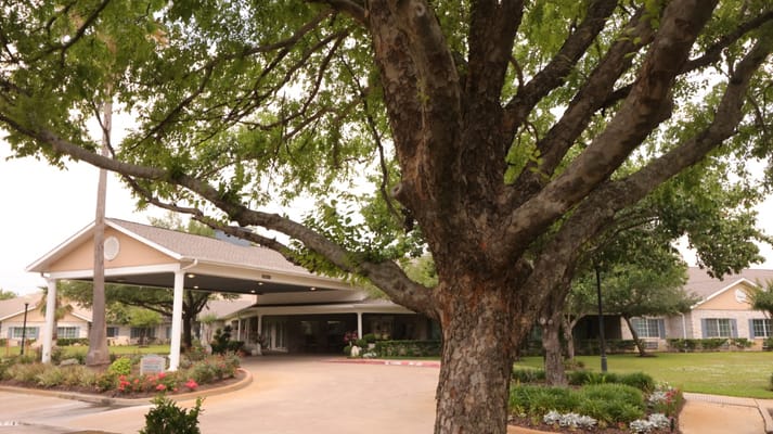Exterior view of the facility entrance with trees