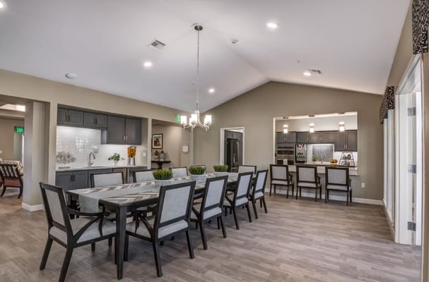 Bright interior dining room with large table and chairs