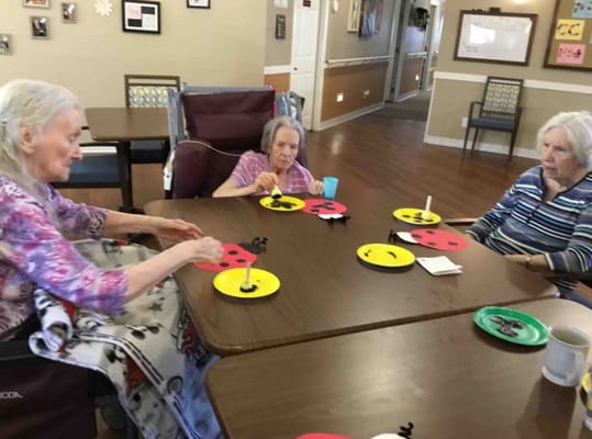 Residents engaging in an activity at a table