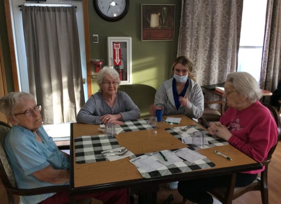 Residents and staff interacting in a communal area