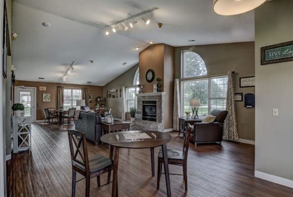 Bright common area with seating and fireplace