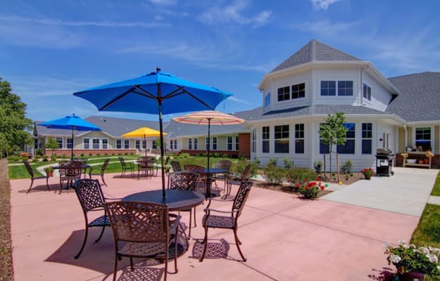 Outdoor patio area with colorful umbrellas and seating