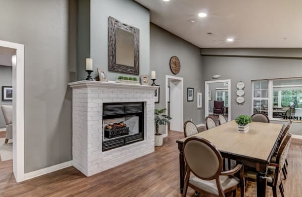 Cozy common area with fireplace and dining table