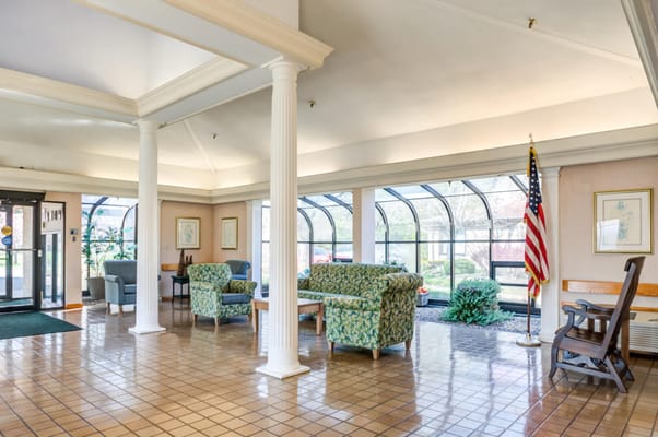 Bright common area with seating and natural light