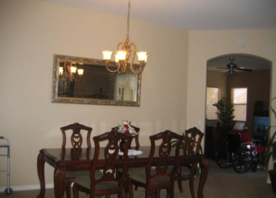 Elegant dining area with wooden table and chairs