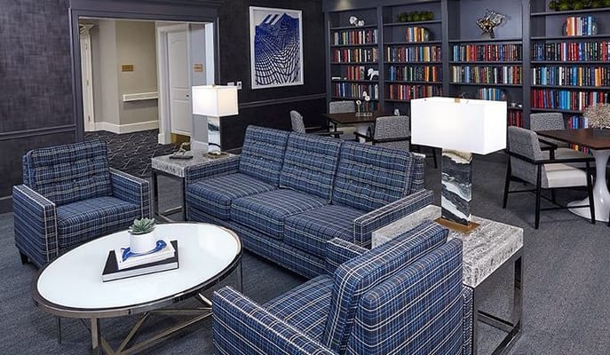 Interior of a common area with seating and bookshelves