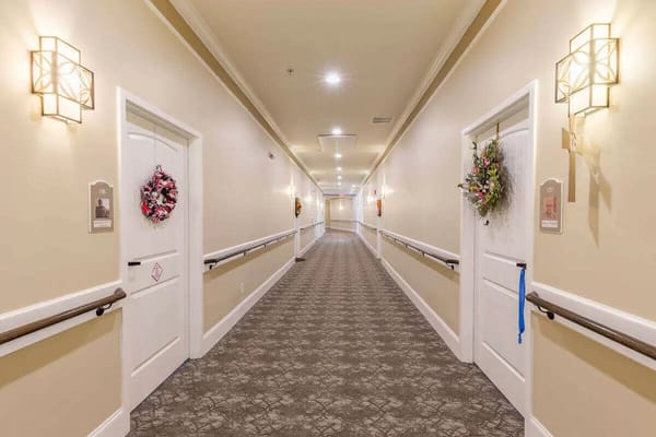 A hallway in the assisted living facility decorated for the holidays