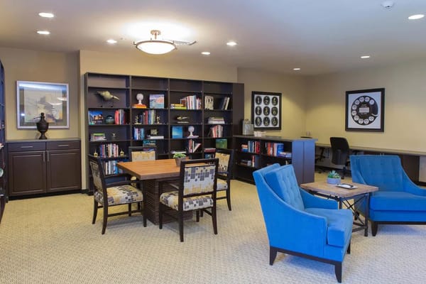 Interior library with seating and bookshelves
