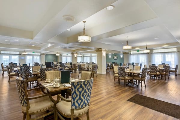 Dining area with tables and chairs in a well-lit room