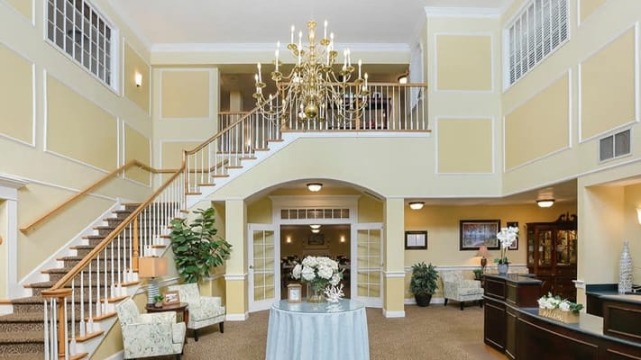 Bright interior lobby with chandelier and seating area