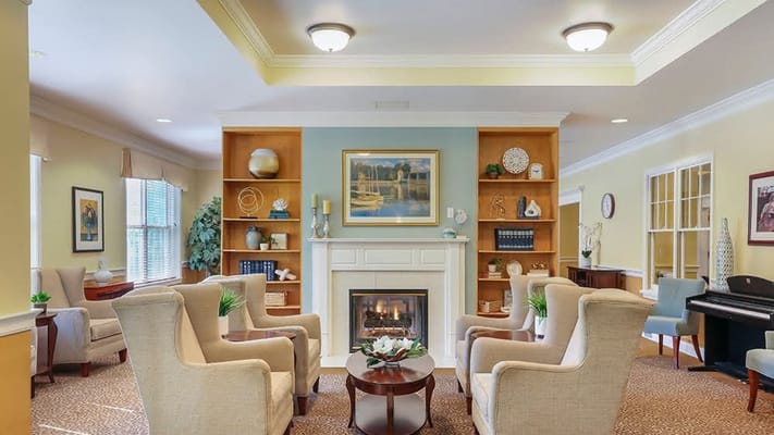 A cozy common area with seating and a fireplace