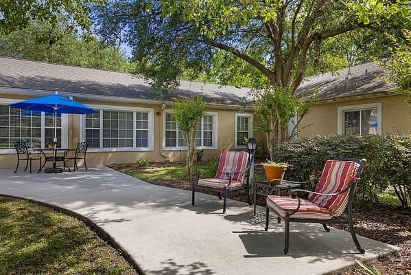 Outdoor relaxation area with seating and umbrella