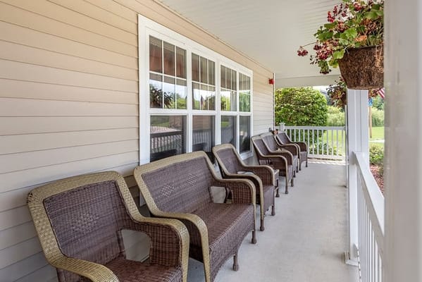 Covered porch with seating for residents