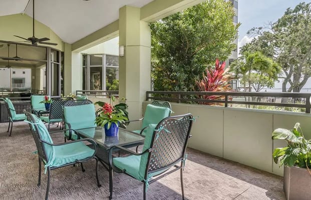 Outdoor patio area with seating and plants