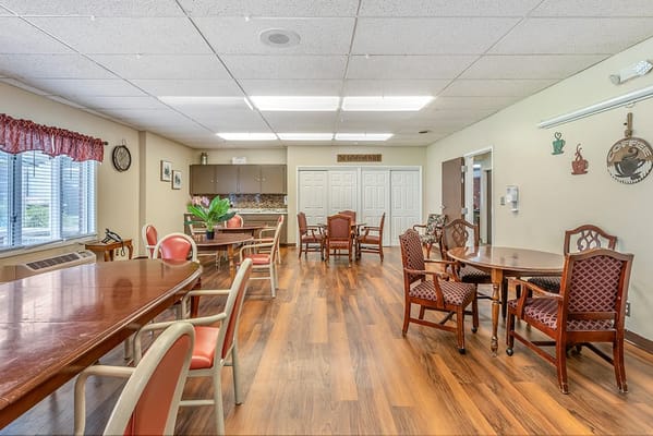 Bright common area with tables and chairs
