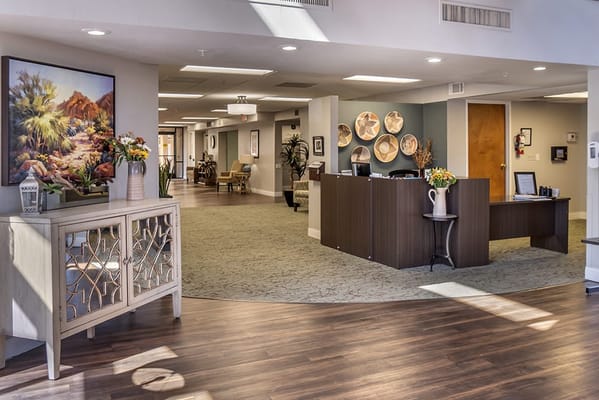 Bright lobby area of a senior living facility with seating