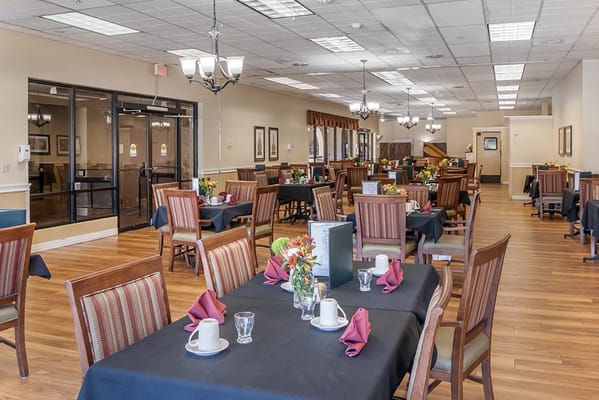 Dining room set up for residents with flowers
