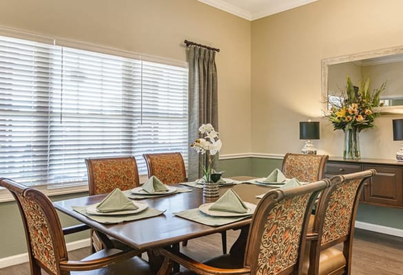 A dining area set for a meal with decorative touches
