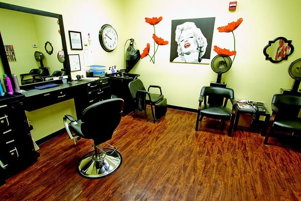 Interior view of a salon with hair styling chairs