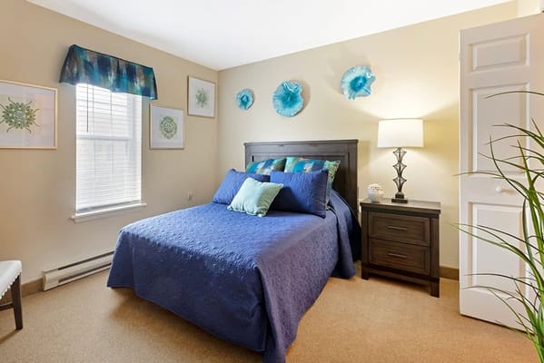 A cozy private bedroom with blue decor