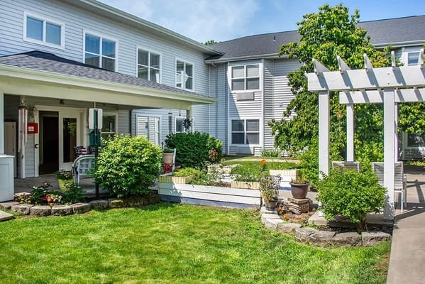 Exterior view of the facility with green garden space
